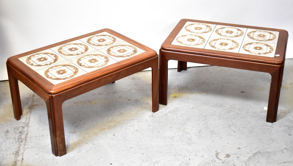 A pair of mid-20th century teak tile-topped side tables,