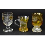 Three 19th century Bohemian glasses comprising a clear glass example with amber overlay small