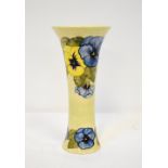 MOORCROFT; a tall trumpet-shaped vase with cylindrical body and flared rim,