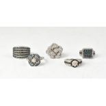 Five sterling silver rings, all set with various coloured diamond stones,