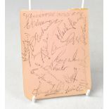 MANCHESTER UNITED; a single page from a scrapbook bearing numerous signatures in pencil,