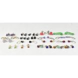 Approximately twenty pairs of sterling silver backed earrings comprising African amethyst,