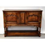 TAYLOR & CO; a 20th century good oak reproduction small open backed dresser,