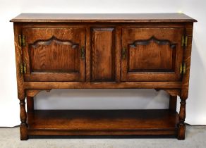 TAYLOR & CO; a 20th century good oak reproduction small open backed dresser,