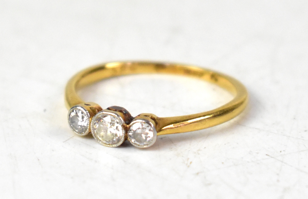 An 18ct yellow gold three-stone diamond ring,