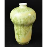 RORSTRAND; a Swedish yellow ground baluster vase, with yellow and green leaf iridescent decoration,