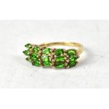 A 9ct yellow gold ring with three rows of five claw set chrome diopside, size O, approx 2.4g.