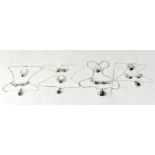 Four sterling silver and gem stone set jewellery sets,