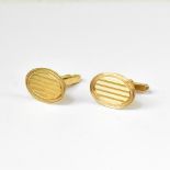 A pair of vintage gentlemen's 9ct gold oval cufflinks with horizontal engine turned decoration,