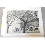 A black folder containing black and white prints by various artists,