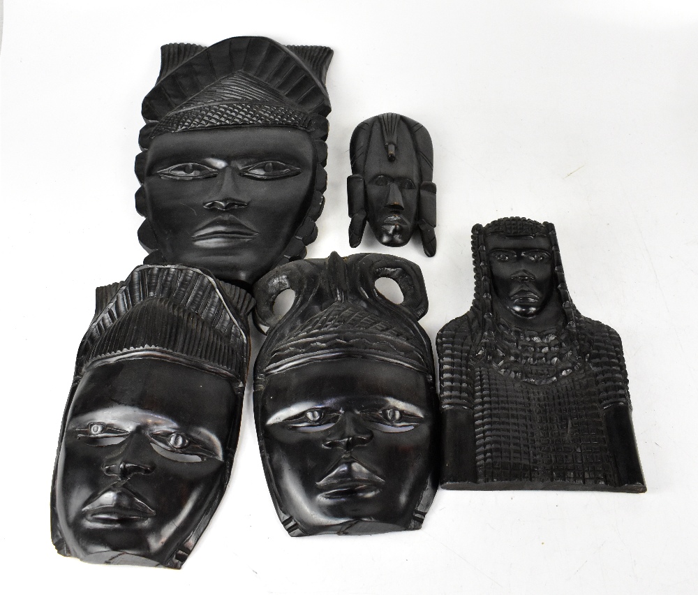 Various modern African carved wooden wall masks, various sizes and styles, the largest 38cm,