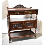 A late Victorian oak buffet, the raised back above two short drawers,