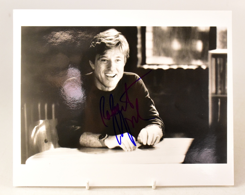 ROBERT REDFORD; a black and white reproduced photograph bearing the actor's signature.