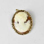 A vintage 14ct gold carved shell cameo with necklace hoop, brooch pin verso and safety chain,