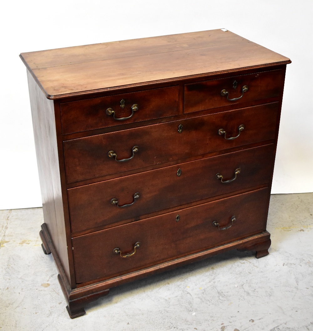 A George III mahogany chest of two short over three long graduated drawers,