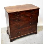 A George III mahogany chest of two short over three long graduated drawers,