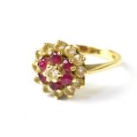 A 9ct yellow gold ladies' dress ring, floral set with white and red stones, size L, approx 2.8g.