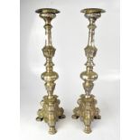 A pair of Baroque-style silver plated candlesticks with moulded acanthus leaf and bulbous columns,