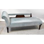 A 1930s stained wooden chaise longue upholstered in blue velour fabric, on turned tapering legs,