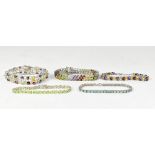 Five sterling silver backed bracelets comprising a multicoloured claw set gemstone three-line