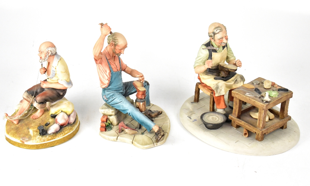 Three Capodimonte figures comprising a shoemaker holding last with boot in one hand and hammer in - Bild 2 aus 2