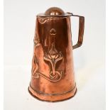 An Arts and Crafts copper flagon in the manner of Joseph Sankey,
