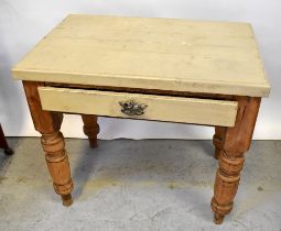A small pine plank top kitchen table with painted top and single frieze drawer,