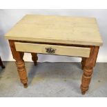 A small pine plank top kitchen table with painted top and single frieze drawer,