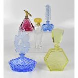 Five perfume bottles to include three Czech examples, vibrant blue with flora and butterfly stopper,
