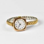 A ladies' vintage 9ct gold wristwatch, the circular white dial set with black Arabic numerals,