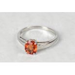 A 9ct white gold orange sapphire solitaire ring, size O, approx 1.8g.