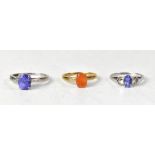 Three 9ct gold rings comprising one with an oval claw set Dourada fire opal,