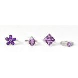 Four gem set hallmarked silver rings comprising a Brazilian amethyst and white topaz sterling