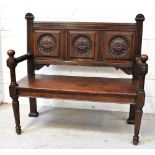 A Victorian carved oak bench, the back s