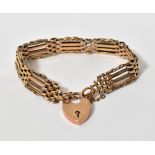 A 9ct yellow gold gate link bracelet wit