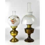A brass oil lamp with opaque globular sh