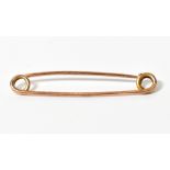 A large vintage 9ct gold safety pin, len