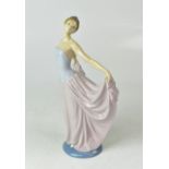 LLADRÓ; a figure of a young lady wearing a ball gown, height 30cm.