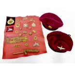 A collection of military and other cap b
