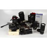 A collection of cameras and lenses to in