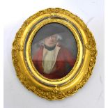 A late 17th/early 18th century oval oil on board, portrait of a Georgian gentleman in bicorne hat,