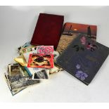 Two postcard albums, one containing mainly topographical historic and social history postcards,