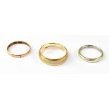 Three 9ct yellow gold wedding bands, siz