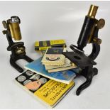 A group of pocket telescopes, including leather-clad brass examples,