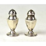 A pair of sterling silver pepperettes, h