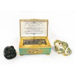 A Halcyon Days limited edition porcelain music box in casket form,
