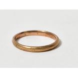 A 9ct gold thin band ring, size M, appro