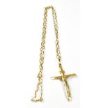 A 9ct yellow gold crucifix and 9ct yello