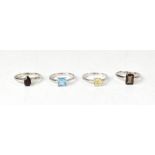Four hallmarked sterling silver rings, a