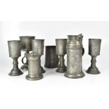 A 19th century pewter drinkware includin